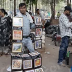 Man Selling Photo Frames - Log, colour and B&W