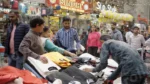 People Buying Clothes in a Market - Log, colour and B&W