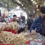 Boy Selling Bangles and Locket - Log, colour and B&W