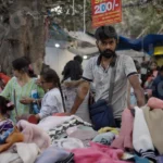 Selling Clothes in a Market - Log, colour and B&W
