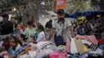 Selling Clothes in a Market - Log, colour and B&W
