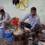 Man Making Tea in a Street - Log, colour and B&W