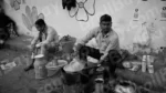 Man Making Tea in a Street - Log, colour and B&W - Image 2