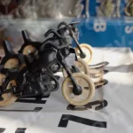 Wooden Motorcycle Toy in a Shop - Log, colour and B&W