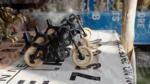 Wooden Motorcycle Toy in a Shop - Log, colour and B&W
