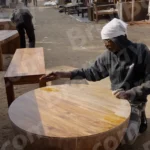 Craftsman Applying a Finish to a Wooden Table - Log, colour and B&W
