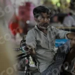 Man sitting in a Cycle Rickshaw - Log, colour and B&W