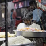 Man Working on a Food Stall - Log, colour and B&W