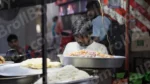 Man Working on a Food Stall - Log, colour and B&W