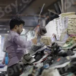 Man Selling Goods in a Street - Log, colour and B&W