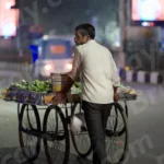 Man Selling Vegitables in a Stall - Log, colour and B&W