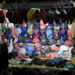 Caps in a Roadside Stall - Log, colour and B&W