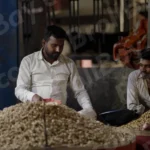Selling Peanuts in a Street - Log, colour and B&W