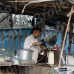 Man Making Tea - Log, colour and B&W