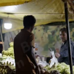 Man Buying Fruits - Log, colour and B&W