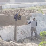 Man Breaking Wall - Log, colour and B&W