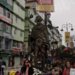 People Taking Pictures with Gandhi ji Statue on Middle of Market Road - Log, colour and B&W