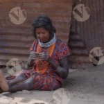 A Tribal Woman Weaving - Log, colour and B&W