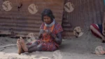 A Tribal Woman Weaving - Log, colour and B&W