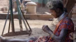 A Tribal Woman Weaving - Log, colour and B&W