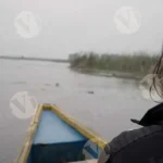 A Man & Woman Traveling on a Boat in a Lake - Log, colour and B&W