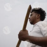 A Man Rowing a Boat Paddle - Log, colour and B&W
