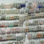 Selling Ear rings & Jhumka in a Market - Log, colour and B&W