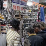 Boy Selling Clothes & Sunglasses in a Market - Log, colour and B&W