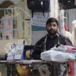 Tailor Sewing Clothes - Log, colour and B&W