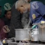 Man Making Tea - Log, colour and B&W