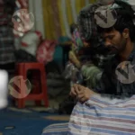 Man Sweing Clothes - Log, colour and B&W