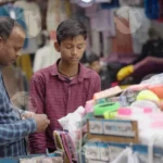 Boy Selling Home Products - Log, colour and B&W
