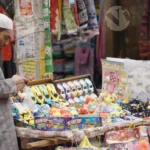 Man Selling Toys - Log, colour and B&W