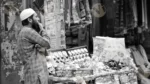 Man Selling Toys - Log, colour and B&W - Image 2