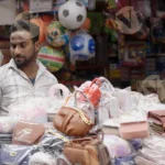 Man Selling Ladies Purse - Log, colour and B&W