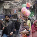 Man Selling Candy in a Market - Log, colour and B&W